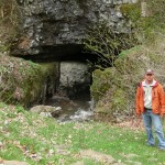 Bill Walker in front of the Upper Snedegars Cave entrance to the Friars Hole Cave System