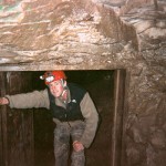 Adam Scherer at the bottom of the culvert in Talley Cave
