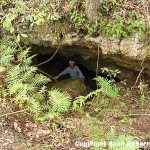 Buford Pruitt in the cave entrance