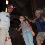 Corey, Caitlyn, and Bill pose with the train