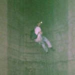 Bill Walker rappels in the 80' pit in Byers