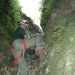 Kristen climbs out of Jennings Cave