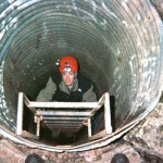 Adam Scherer in the culvert entrance to Talley Cave